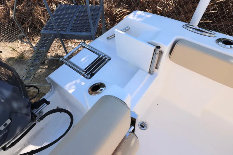 Slide: The Image of 2022 Tidewater 220 CC Adventure boat stern with ladder and seating. - 13