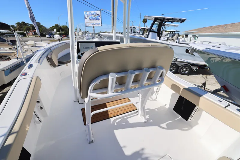 Slide: The Image of 2022 Tidewater 220 CC Adventure boat interior with seating and rod holders. - 16