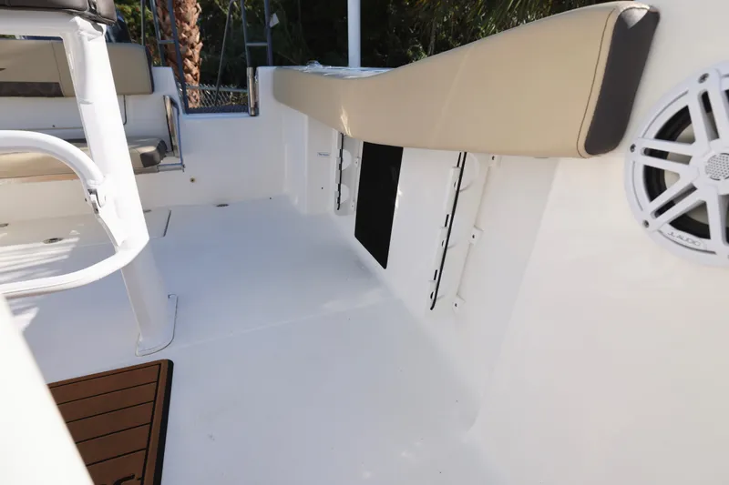 Slide: The Image of 2022 Tidewater 220 CC Adventure boat interior with seating and speaker. - 22