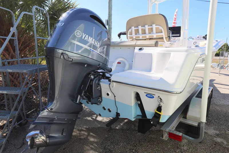 Slide: The Image of 2022 Tidewater 220 CC Adventure boat with Yamaha outboard motor, parked on trailer. - 8