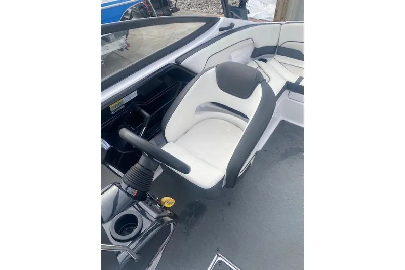 Slide: The Image of 2017 Yamaha Boats AR210 interior with steering wheel and seating area. - 12