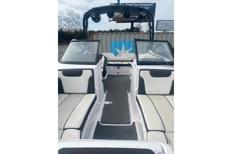 Slide: The Image of 2017 Yamaha Boats AR210 interior with seating and windshield, showcasing sleek design. - 9