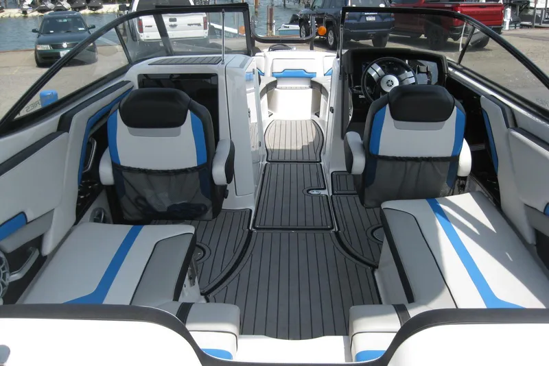 Slide: The Image of 2018 Yamaha Boats 242X E-Series interior with sleek seating and modern design. - 10