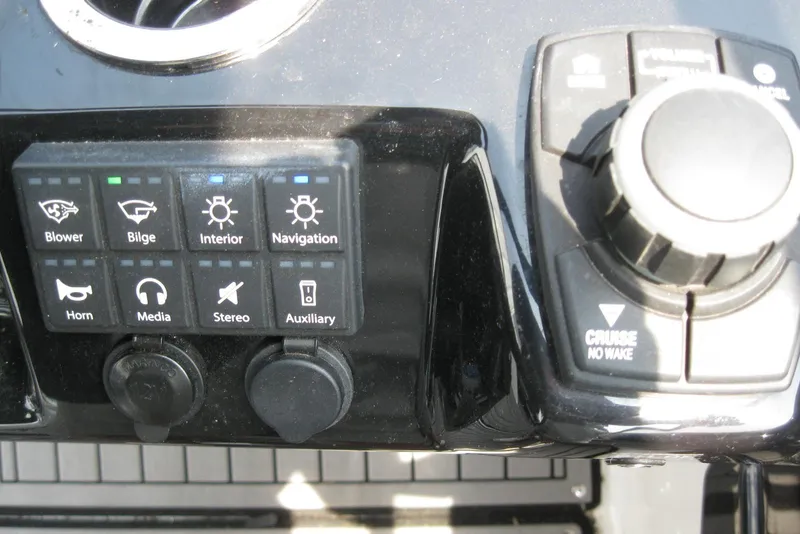 Slide: The Image of Control panel of 2018 Yamaha Boats 242X E-Series with various function buttons. - 24