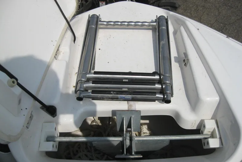 Slide: The Image of 2018 Yamaha Boats 242X E-Series anchor storage with foldable ladder. - 30