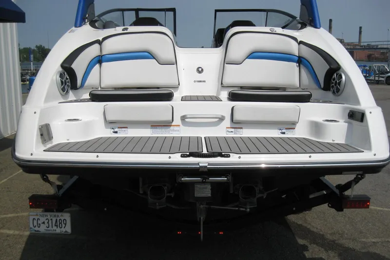 Slide: The Image of 2018 Yamaha Boats 242X E-Series rear view with seating and speakers. - 6