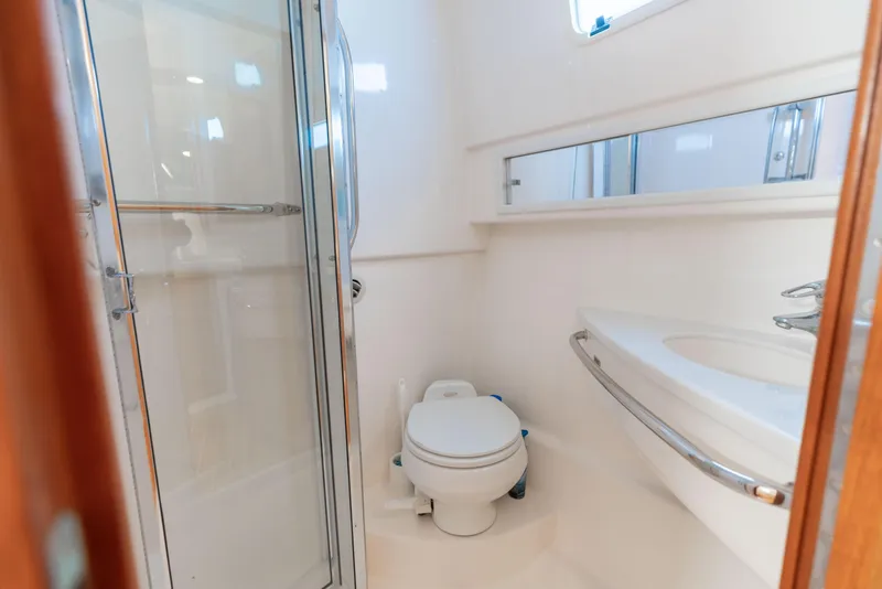 Slide: The Image of Bathroom interior of 2000 Cabo 35 Express yacht with shower and toilet. - 14