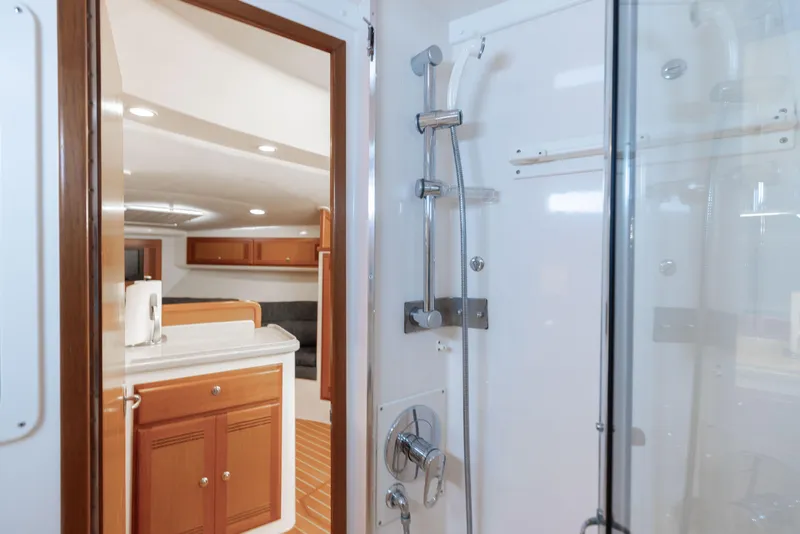 Slide: The Image of Interior of 2000 Cabo 35 Express yacht featuring shower and cabin area. - 15