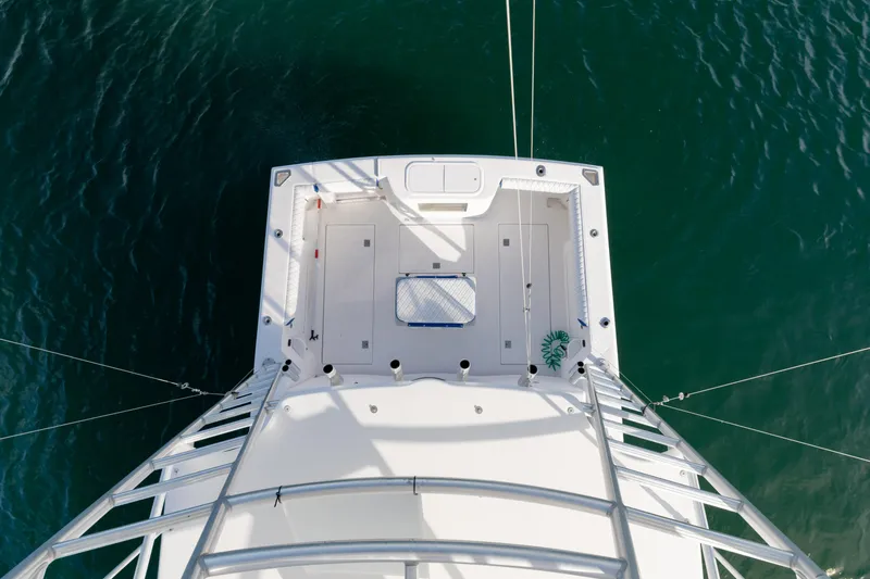 Slide: The Image of Aerial view of 2000 Cabo 35 Express boat deck on calm water. - 27