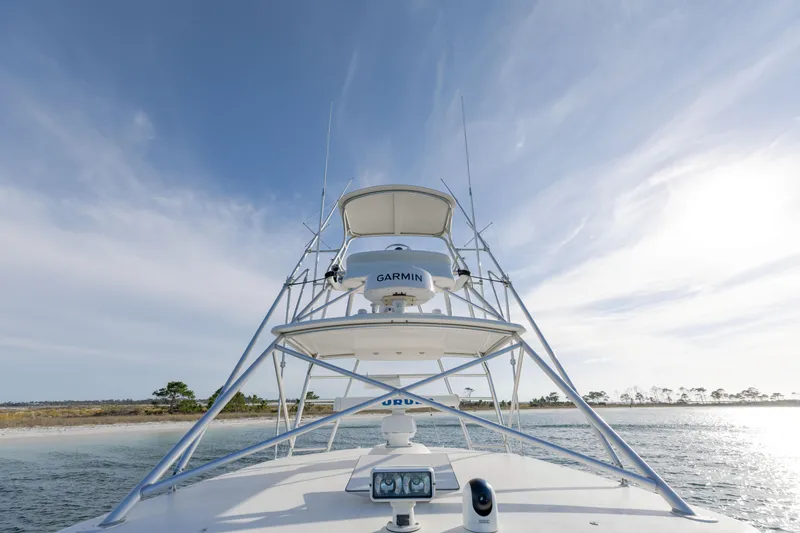 Slide: The Image of Cabo 35 Express 2000 boat with Garmin equipment on open water under blue sky. - 31