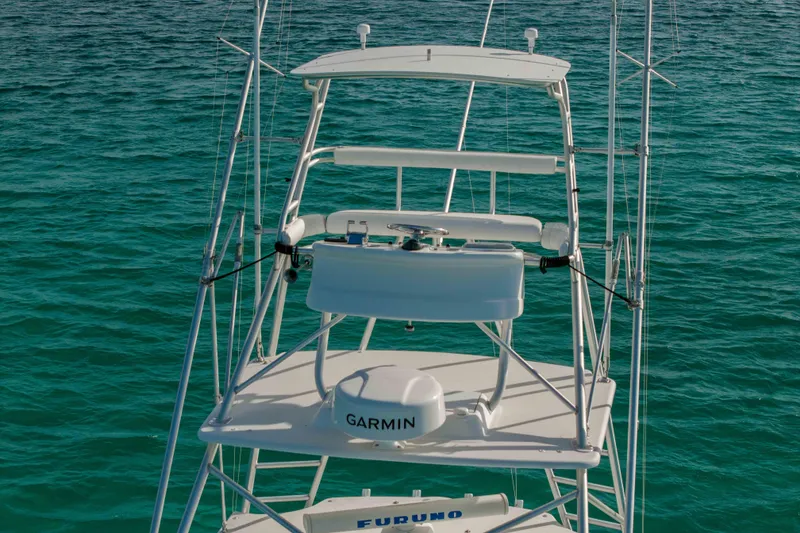 Slide: The Image of Cabo 35 Express 2000 boat tower with Garmin equipment on turquoise water. - 45