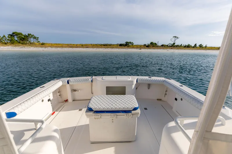 Slide: The Image of 2000 Cabo 35 Express boat interior with ocean view and sandy shoreline. - 5