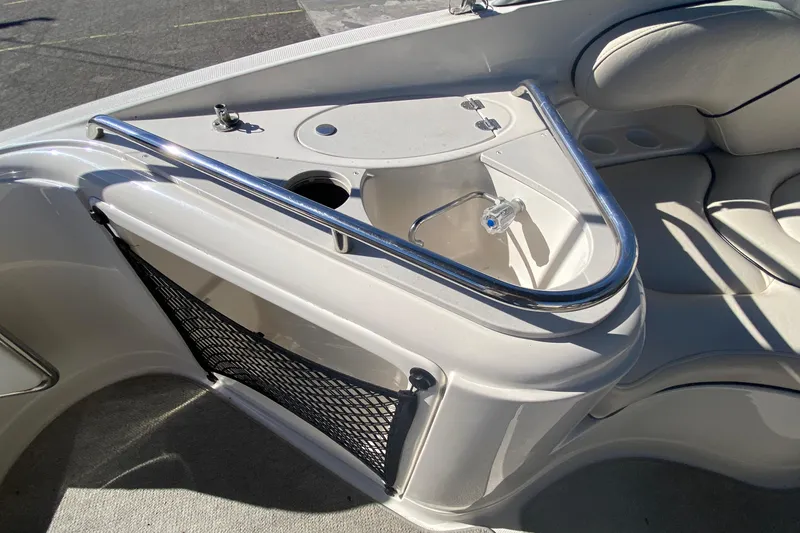 Slide: The Image of 2004 Monterey 245 Cruiser interior with sink and seating area. - 15