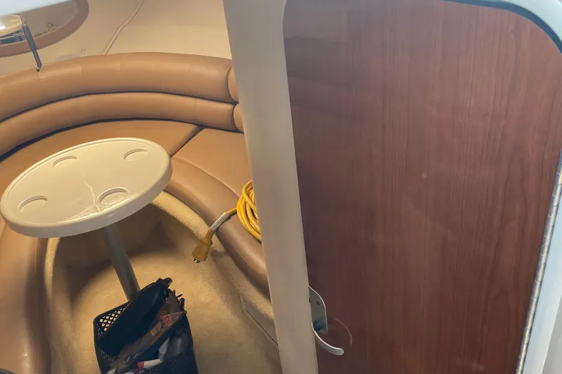 Slide: The Image of Interior of 2004 Monterey 245 Cruiser with beige seating and table. - 19