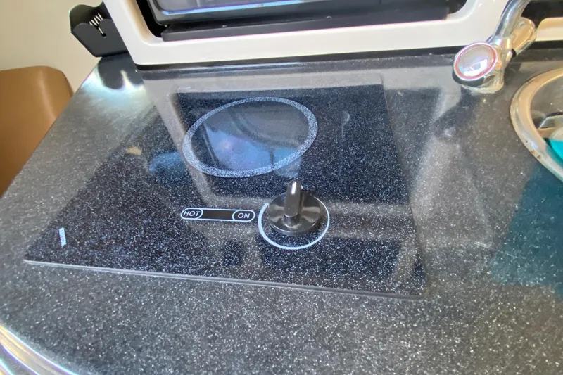 Slide: The Image of Electric stove in 2004 Monterey 245 Cruiser boat kitchen area. - 32