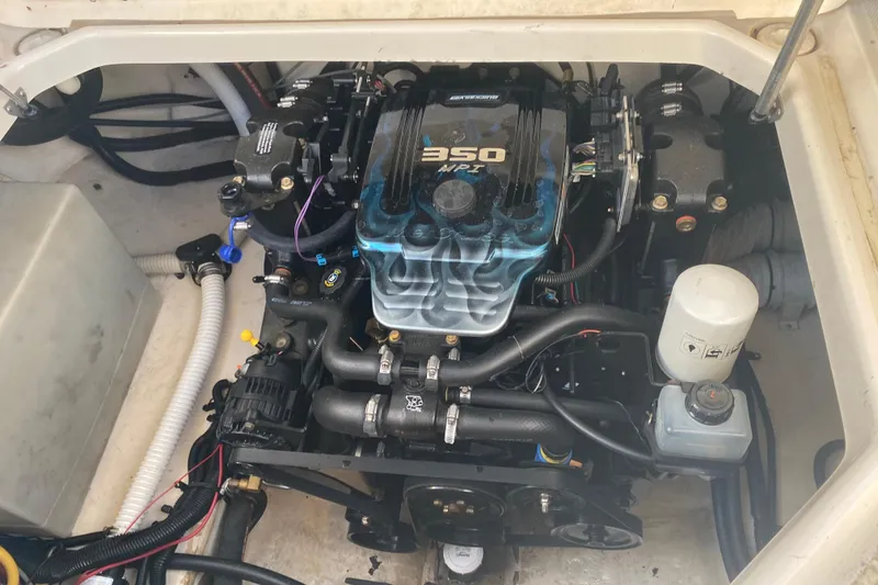 Slide: The Image of Engine of 2004 Monterey 245 Cruiser boat, featuring a 350 MPI motor. - 37