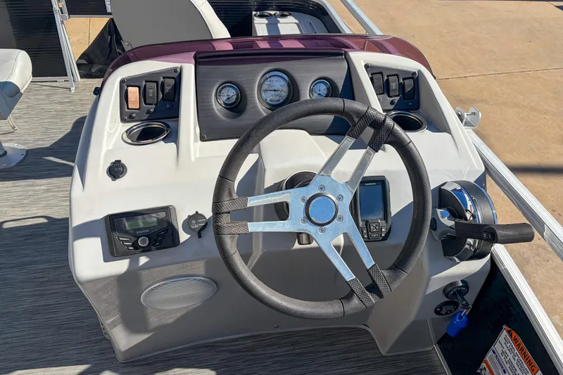 Slide: The Image of 2021 Bennington 188 SV boat dashboard with steering wheel and control panel. - 12