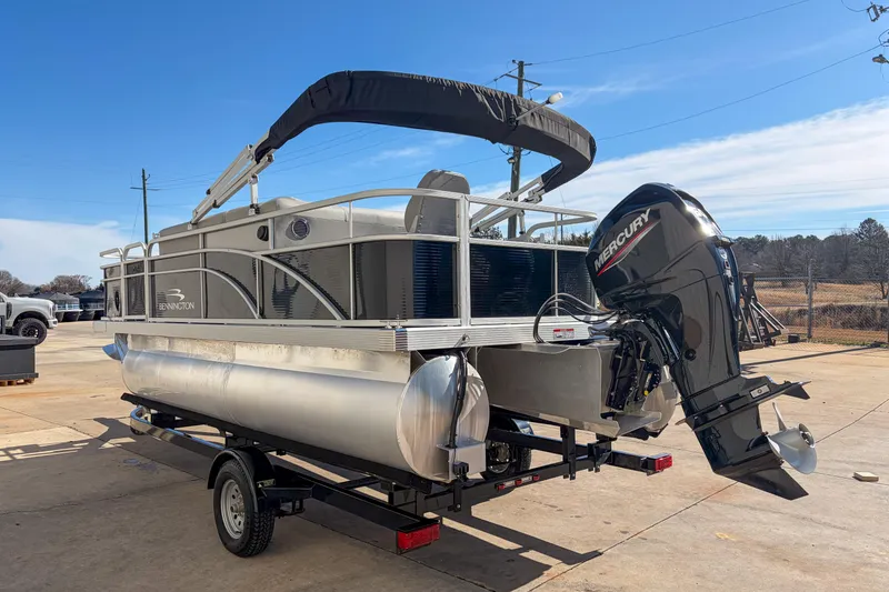 Slide: The Image of 2021 Bennington 188 SV pontoon boat with Mercury outboard motor on trailer. - 4
