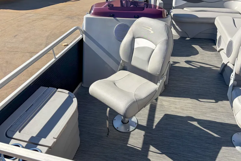 Slide: The Image of 2021 Bennington 188 SV boat interior with gray seating and storage compartment. - 8