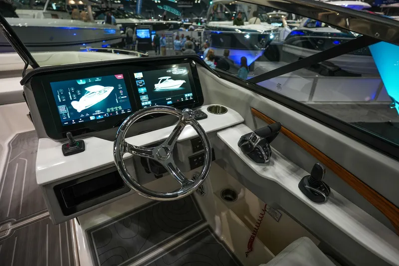 Slide: The Image of 2026 Regal LX9 boat dashboard with advanced touchscreen controls and steering wheel. - 10
