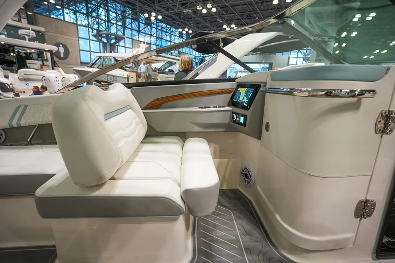 Slide: The Image of Luxurious interior of 2026 Regal LX9 boat with modern dashboard and seating. - 11