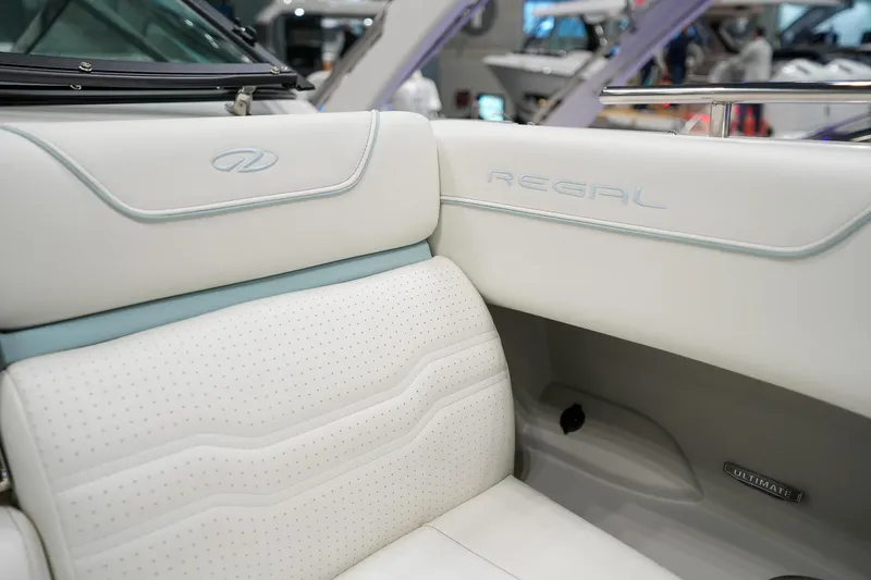 Slide: The Image of Luxurious interior of 2026 Regal LX9 boat with white perforated leather seating. - 13