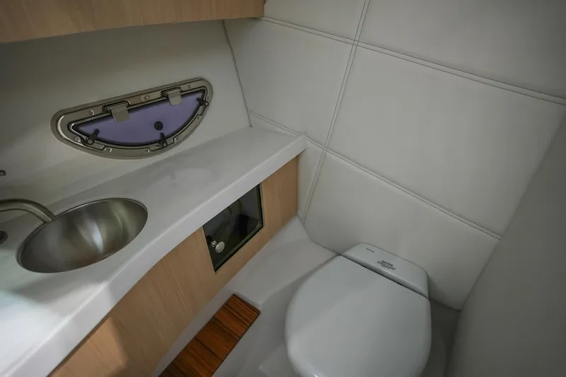 Slide: The Image of Luxurious bathroom in 2026 Regal LX9 boat with modern sink and toilet. - 16