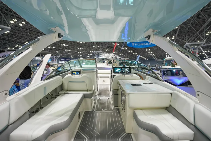 Slide: The Image of Luxurious interior of 2026 Regal LX9 boat at a boat show. - 4