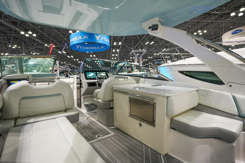 Slide: The Image of Luxurious interior of 2026 Regal LX9 boat at a boat show. - 5