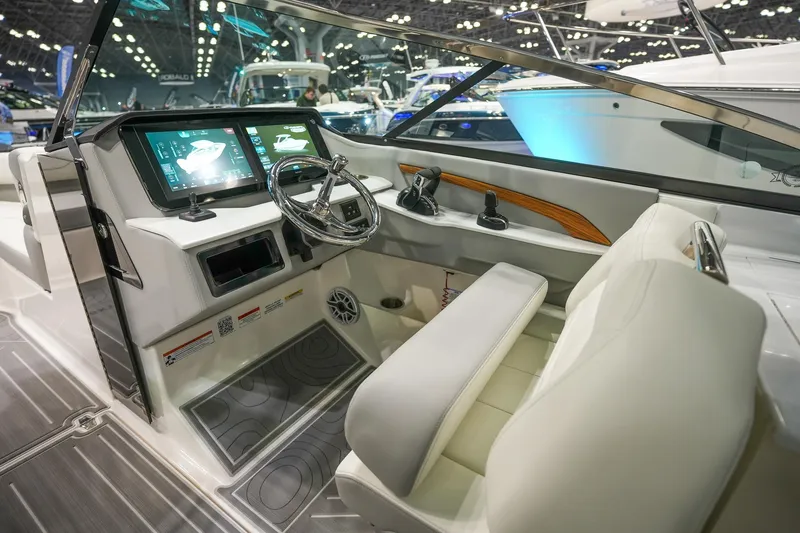 Slide: The Image of 2026 Regal LX9 boat interior with modern dashboard and steering wheel. - 9