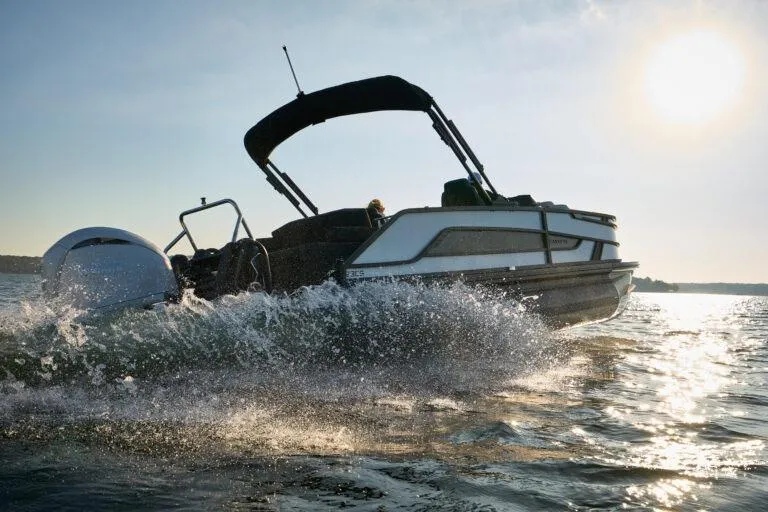 Slide: The Image of Manufacturer Provided Image: Evotti 721CS boat cruising on water at sunset, 2026 model. - 4