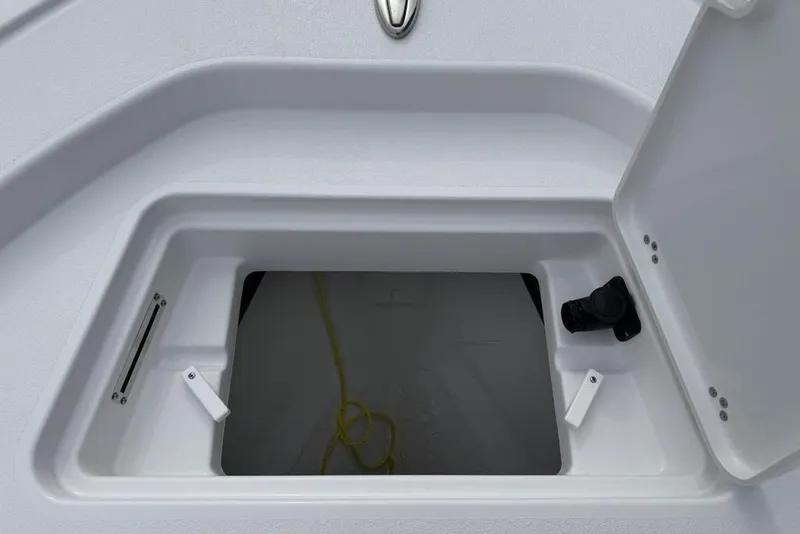 Slide: The Image of Open storage compartment on 2026 Sportsman Masters 227 Bay Boat. - 10