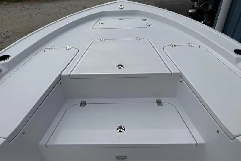 Slide: The Image of 2026 Sportsman Masters 227 Bay Boat deck with storage compartments. - 11