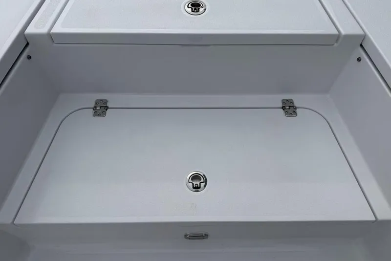 Slide: The Image of 2026 Sportsman Masters 227 Bay Boat storage compartment with secure latches and sleek design. - 14