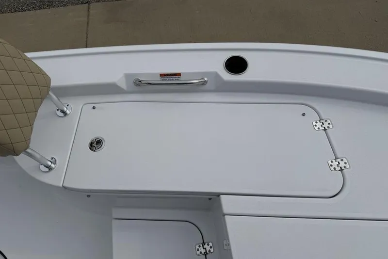 Slide: The Image of 2026 Sportsman Masters 227 Bay Boat deck with storage compartment and seating. - 15