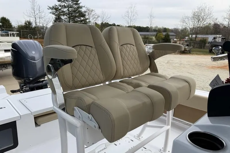 Slide: The Image of 2026 Sportsman Masters 227 Bay Boat with luxurious tan seating and armrests. - 18