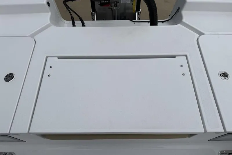 Slide: The Image of 2026 Sportsman Masters 227 Bay Boat deck with storage compartments and clean design. - 27