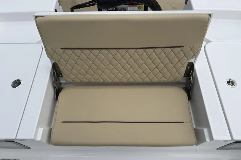 Slide: The Image of 2026 Sportsman Masters 227 Bay Boat seat with beige quilted upholstery. - 29