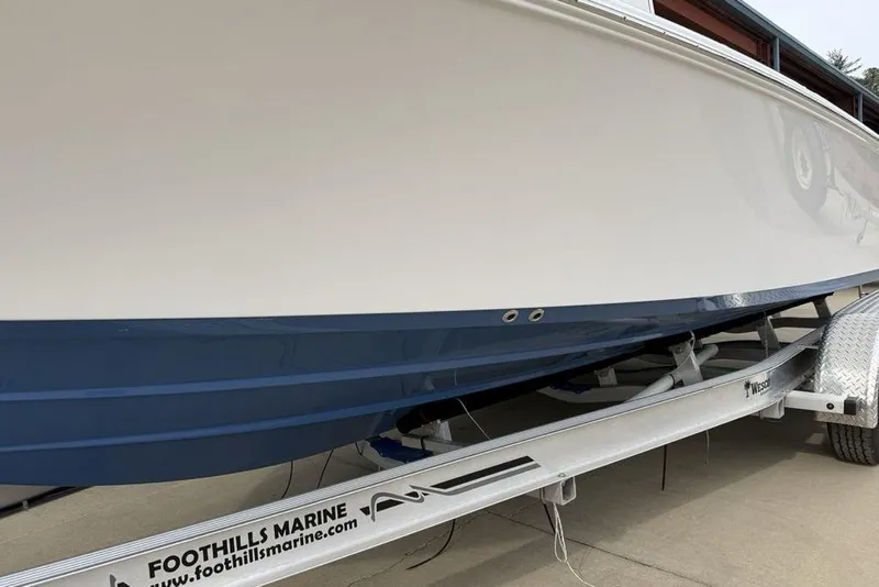 Slide: The Image of 2026 Sportsman Masters 227 Bay Boat on trailer, side view. - 5