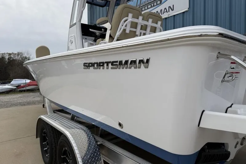 Slide: The Image of 2026 Sportsman Masters 227 Bay Boat on trailer, showcasing sleek design and branding. - 6