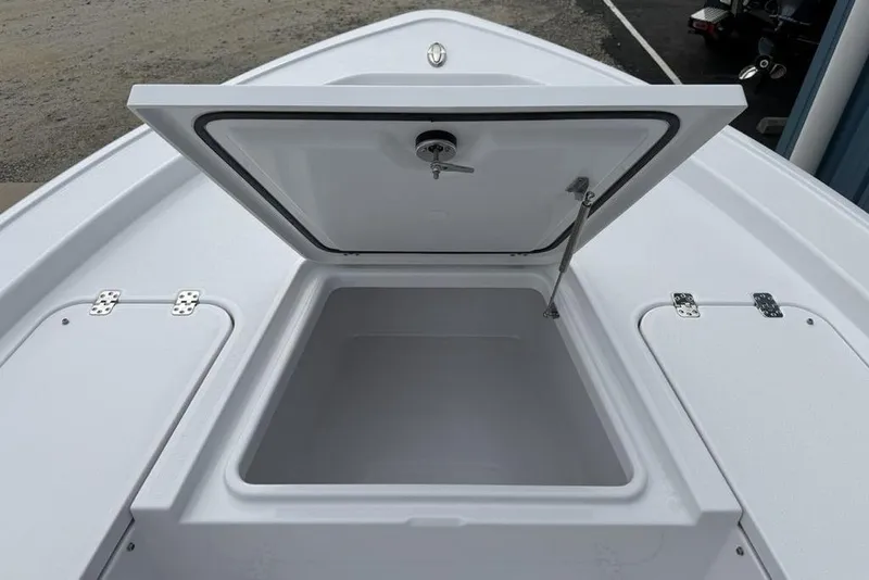 Slide: The Image of Open storage compartment on 2026 Sportsman Masters 227 Bay Boat deck. - 7