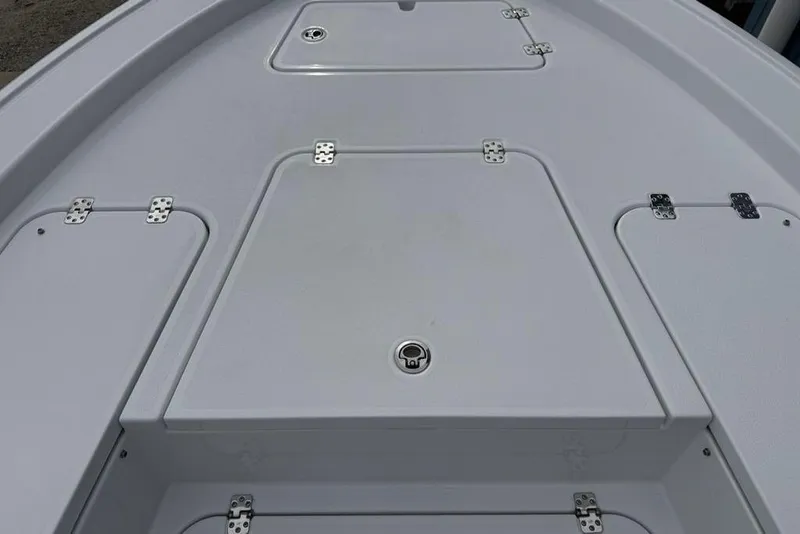 Slide: The Image of Deck of 2026 Sportsman Masters 227 Bay Boat with storage compartments. - 8