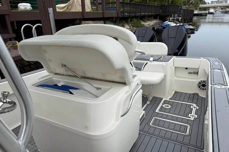 Slide: The Image of 2020 SeaVee 290B boat interior with open storage compartment and modern deck design. - 11