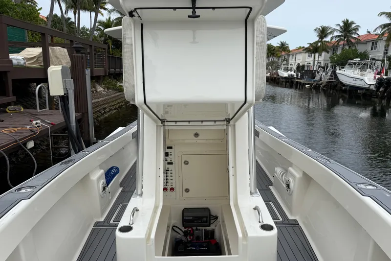 Slide: The Image of 2020 SeaVee 290B boat interior with open hatch, dockside view. - 16