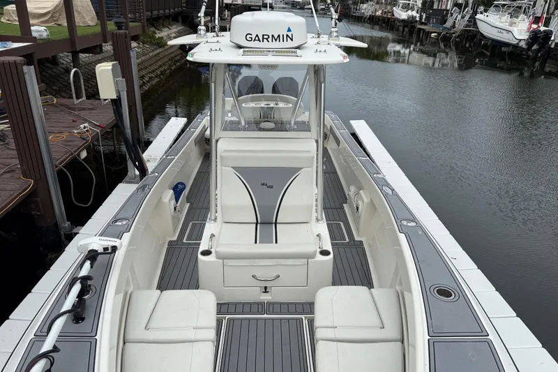 Slide: The Image of 2020 SeaVee 290B boat with Garmin equipment docked in a marina. - 20