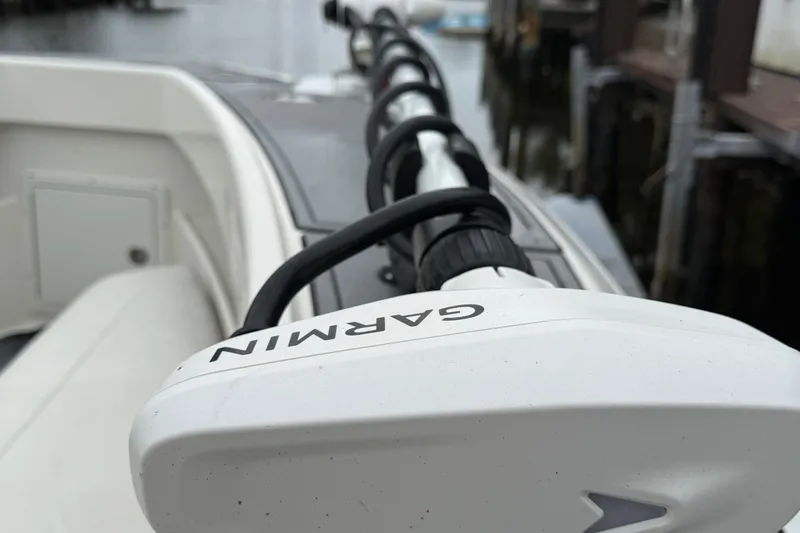 Slide: The Image of 2020 SeaVee 290B boat with Garmin equipment, docked near water. - 22