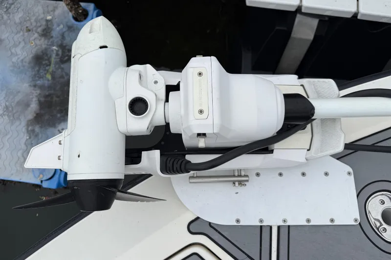 Slide: The Image of 2020 SeaVee 290B boat with mounted trolling motor, docked. - 23