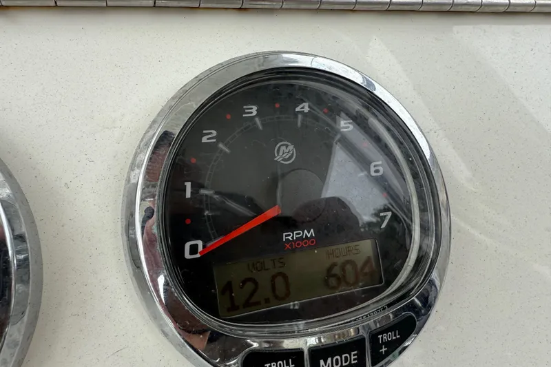 Slide: The Image of Close-up of SeaVee 290B 2020 boat tachometer showing 12 volts and 604 hours. - 27