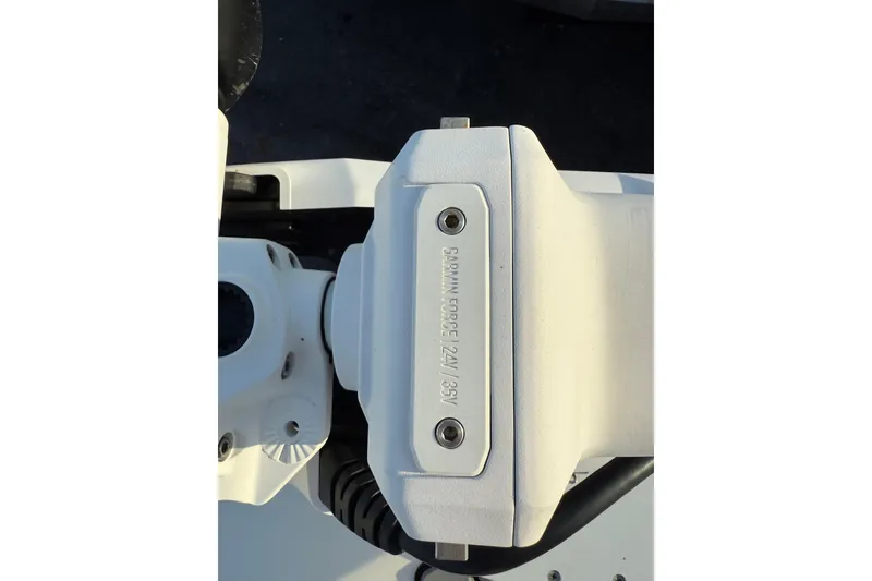 Slide: The Image of 2020 SeaVee 290B boat docked, featuring a spacious deck and modern console. - 4