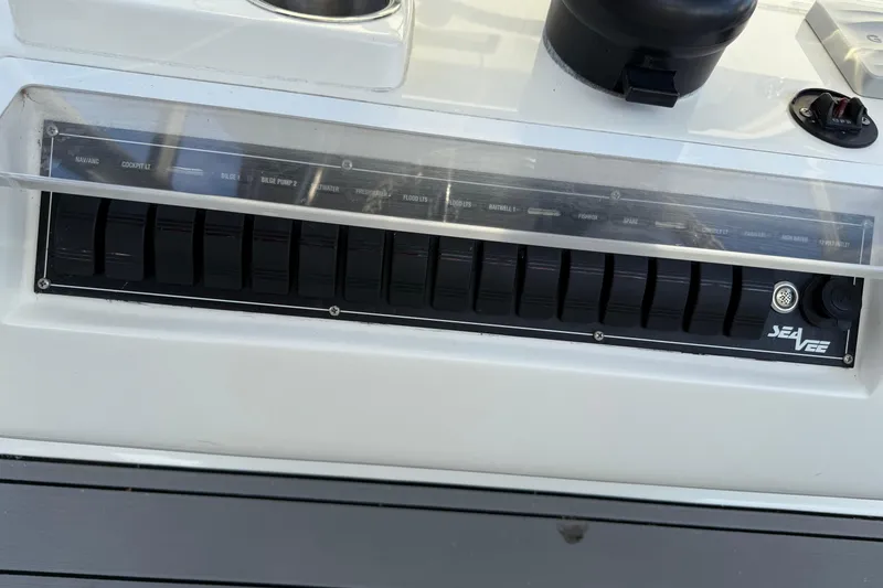 Slide: The Image of 2020 SeaVee 290B boat interior with storage compartments and fishing tools. - 5